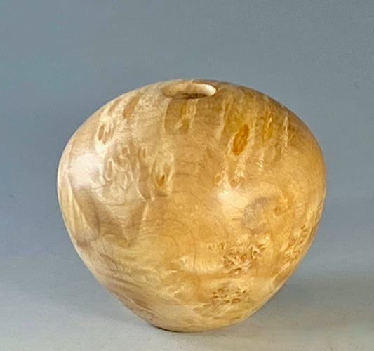 HOLLOW FORM TURNED FROM ROCK MAPLE BURL