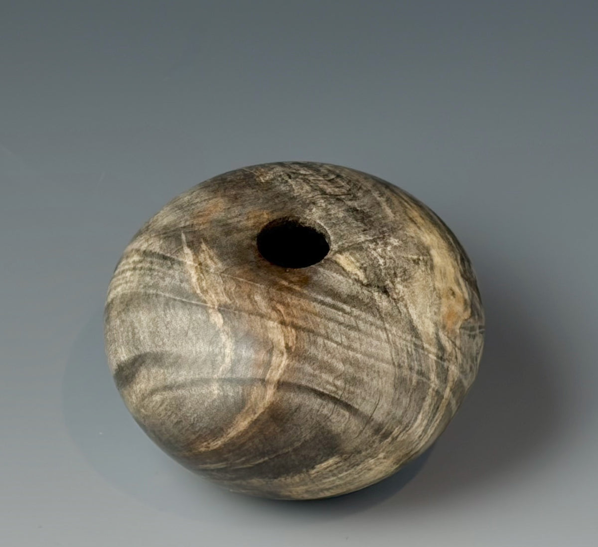 HOLLOW FORM TURNED FROM BUCKEYE BURL