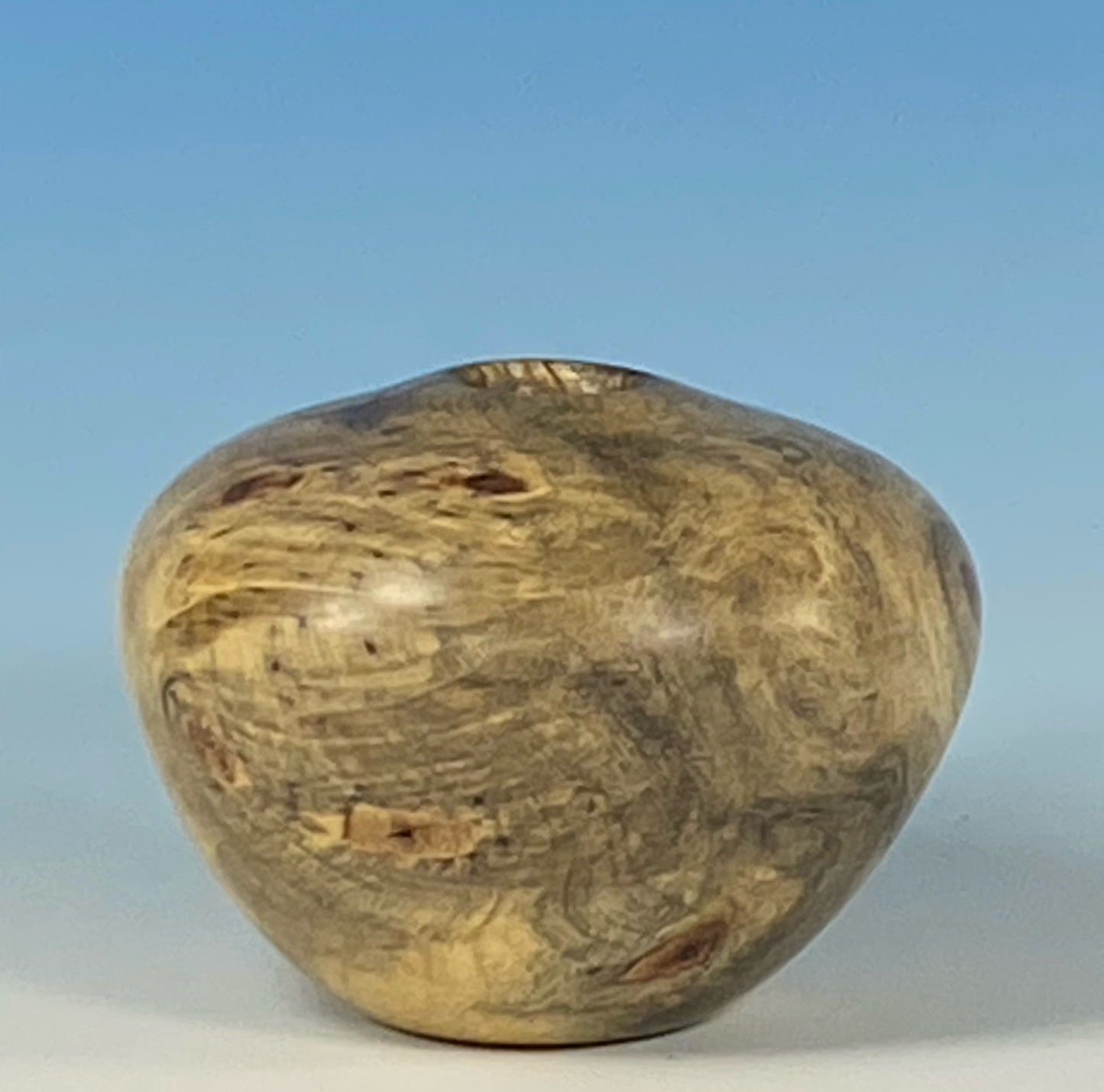 HOLLOW FORM TURNED FROM BUCKEYE BURL, WITH TURQUOISE INLAY
