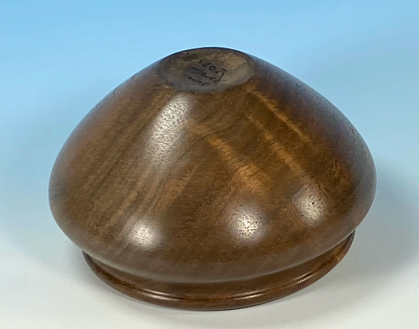 ENCLOSED FORM TURNED FROM FIGURED CLARO WALNUT