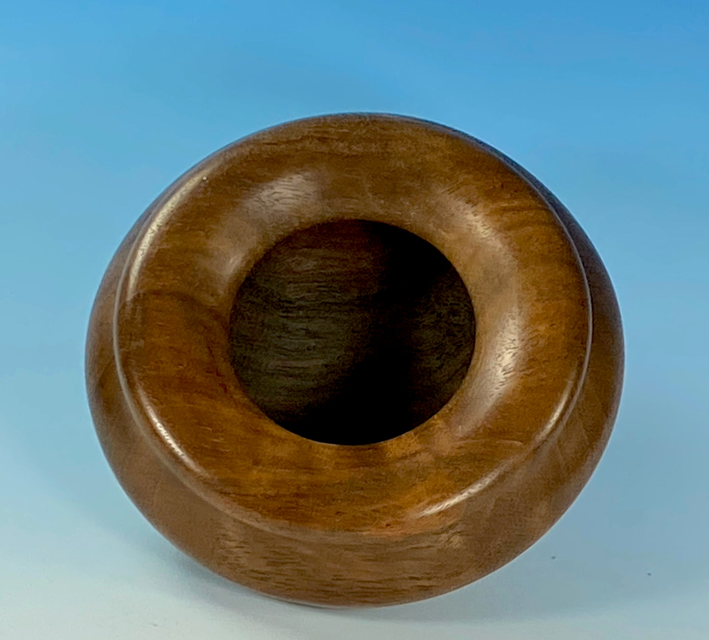 ENCLOSED FORM TURNED FROM FIGURED CLARO WALNUT