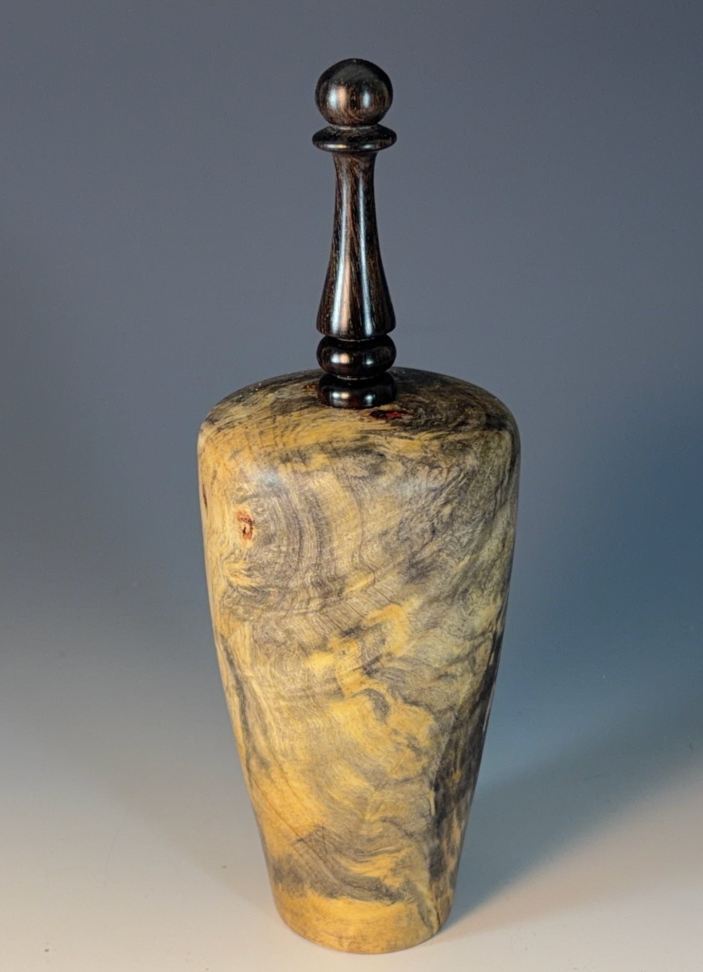 VESSEL TURNED FROM BUCKEYE BURL, WITH AFRICAN BLACKWOOD FINIAL