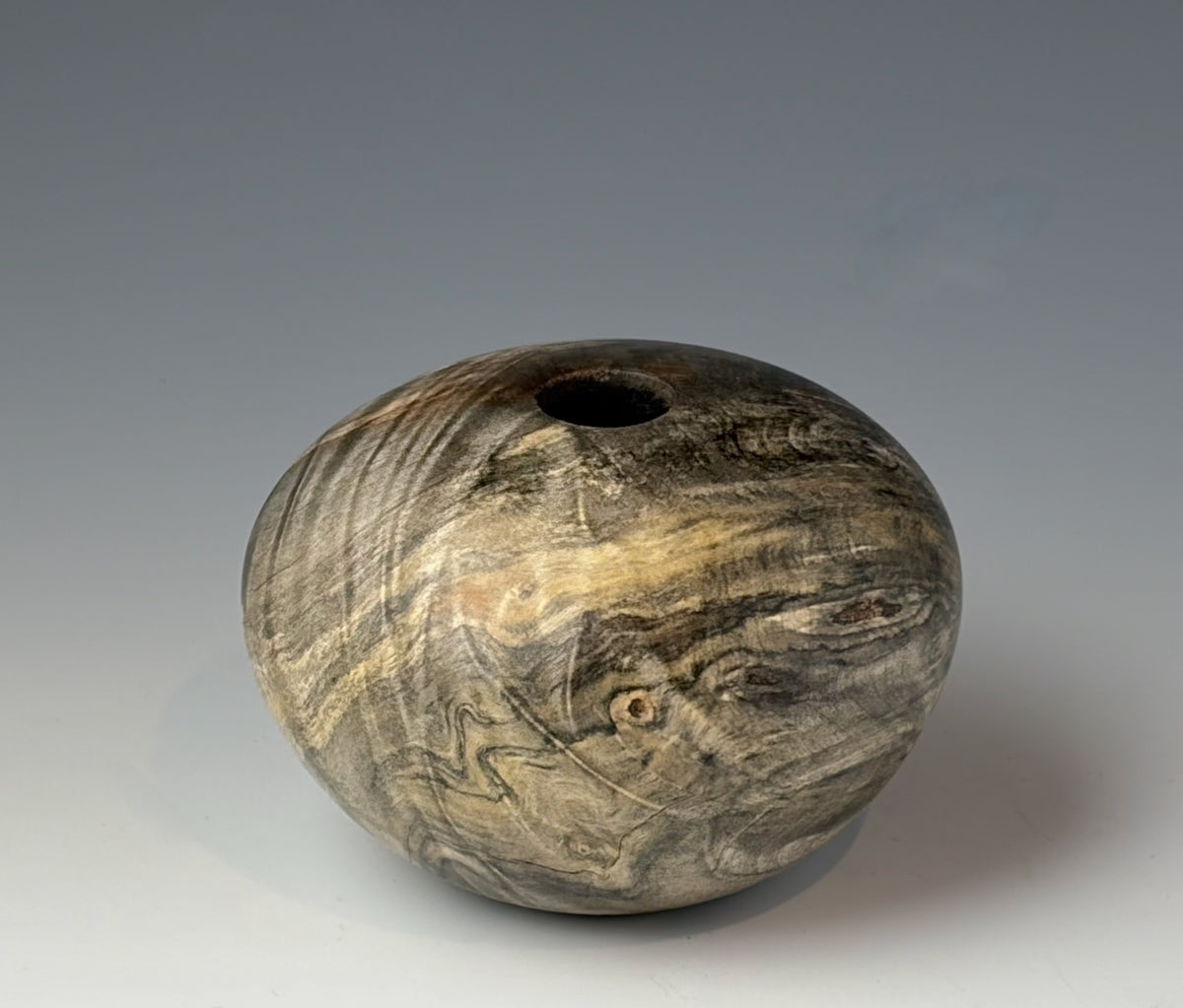 HOLLOW FORM TURNED FROM BUCKEYE BURL