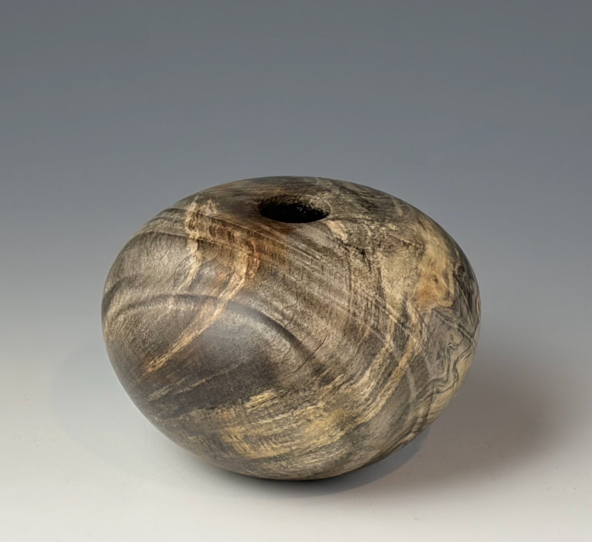HOLLOW FORM TURNED FROM BUCKEYE BURL