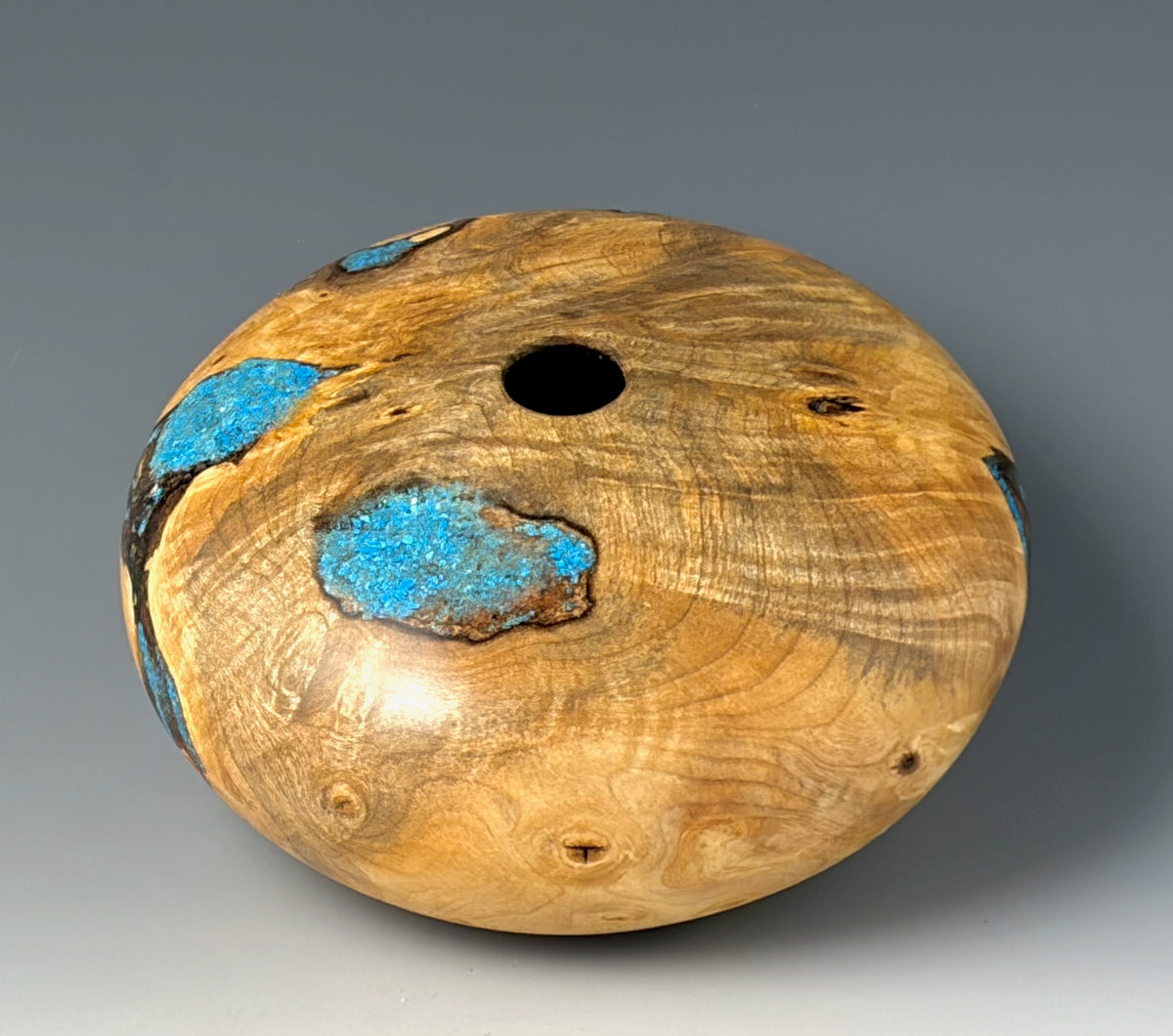 HOLLOW FORM TURNED FROM BUCKEYE BURL, WITH TURQUOISE INLAY