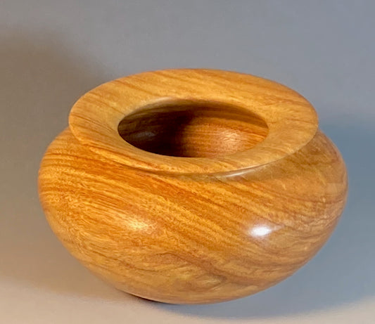 ENCLOSED FORM TURNED FROM CANARYWOOD
