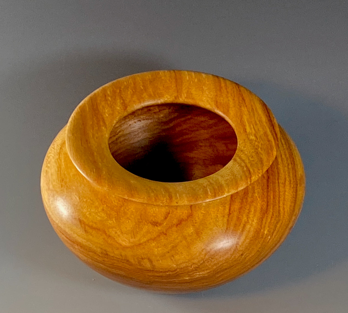 ENCLOSED FORM TURNED FROM CANARYWOOD