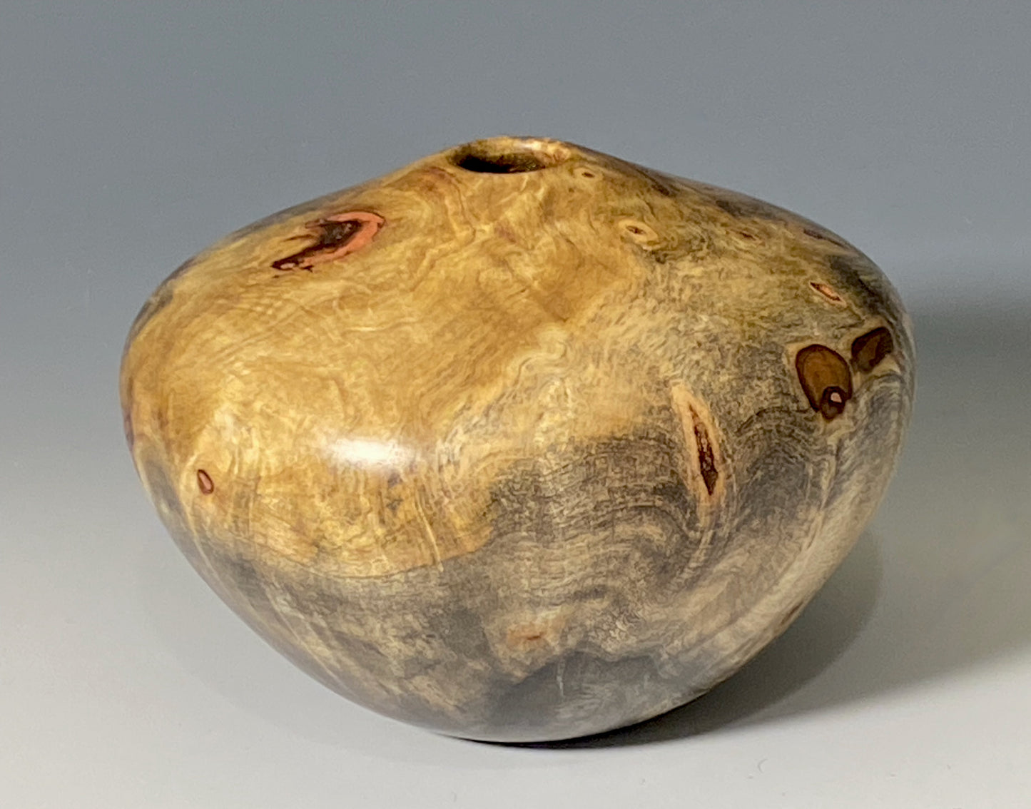 HOLLOW FORM TURNED FROM BUCKEYE BURL